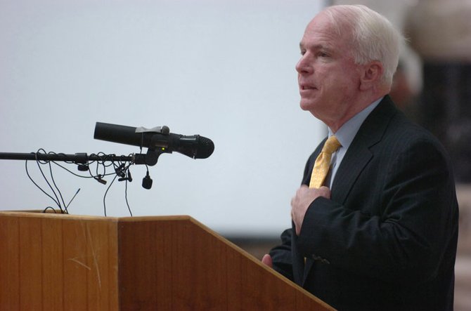 Sen. John McCain spoke during the Multi-National Force Iraq Reenlistment, naturalization and Independence Day ceremony at Camp Victory, Iraq in July 2007.