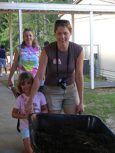 Organizer Serenity Albright and her daughter, Eva, helped plant vegetables in Casey Elementary School's organic community garden June 7.